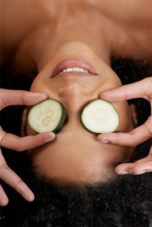 Close-up of a young woman with cucumber slices on her eyes Stock Photo - Premium Royalty-Free, Code: 625-01261877