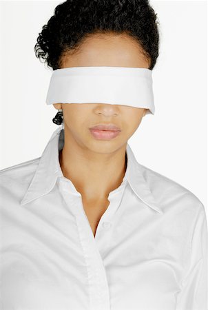 Close-up of a businesswoman blindfolded Stock Photo - Premium Royalty-Free, Code: 625-01261993