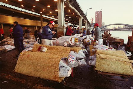 Male buyers inspecting tuna in a fish market, Tsukiji Fish market, Tsukiji, Tokyo Prefecture, Japan Stock Photo - Premium Royalty-Free, Code: 625-01262062