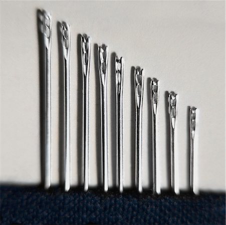 sewing needle close up - Close-up of needles in a row Stock Photo - Premium Royalty-Free, Code: 625-01262482