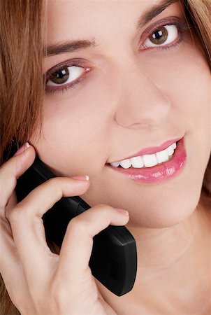 simsearch:625-01092988,k - Portrait of a businesswoman talking on a mobile phone and smiling Foto de stock - Royalty Free Premium, Número: 625-01262530