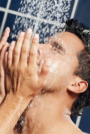 Close-up of a young man in the shower Stock Photo - Premium Royalty-Free, Code: 625-01262865