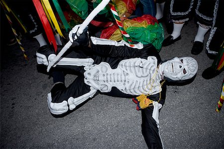 people lying down on the road - High angle view of a man wearing costume and performing in a traditional festival Stock Photo - Premium Royalty-Free, Code: 625-01263064