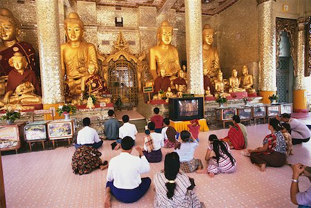 Rear view of pilgrims praying in a pagoda, Shwedagon Pagoda, Yangon, Myanmar Stock Photo - Premium Royalty-Free, Code: 625-01263101