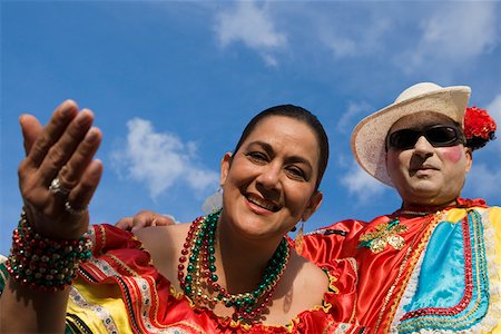 Low angle view of a mature couple wearing costumes and smiling Stock Photo - Premium Royalty-Free, Code: 625-01263140