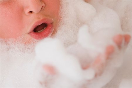 Close-up of a boy in a bubble bath Stock Photo - Premium Royalty-Free, Code: 625-01263190