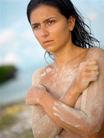 simsearch:625-02930713,k - Close-up of a young woman covering her breast Stock Photo - Premium Royalty-Free, Code: 625-01263313