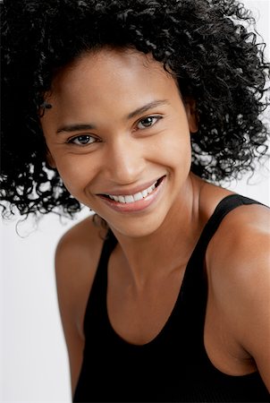 simsearch:625-01097322,k - Portrait of a young woman smiling Stock Photo - Premium Royalty-Free, Code: 625-01263393