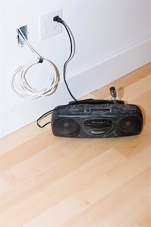 Tape recorder on the floor Stock Photo - Premium Royalty-Free, Code: 625-01263507