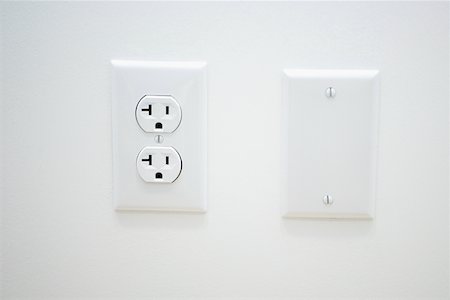 electrical outlet - Close-up of an outlet on a wall Stock Photo - Premium Royalty-Free, Code: 625-01263640