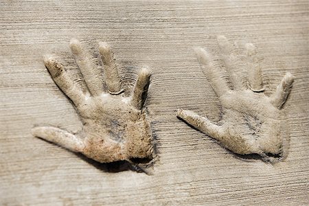 Close-up of handprints on a wall Stock Photo - Premium Royalty-Free, Code: 625-01263806