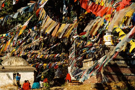 Group of people sitting under prayer flags, Monkey Temple, Katmandu, Nepal Stock Photo - Premium Royalty-Free, Code: 625-01263852