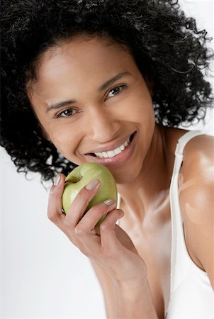 simsearch:625-01097322,k - Portrait of a young woman holding an apple Stock Photo - Premium Royalty-Free, Code: 625-01263992