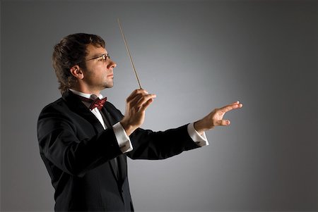 Close-up of a musician holding a conductor's baton Foto de stock - Royalty Free Premium, Número: 625-01744012