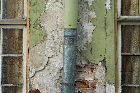 Close-up of a pipe mounted on a wall Stock Photo - Premium Royalty-Free, Code: 625-01744056