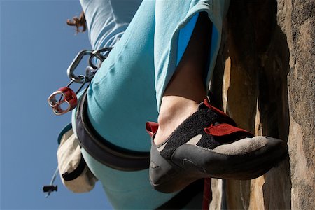 extreme rock climbing close up - Low section view of a female climber rock climbing Stock Photo - Premium Royalty-Free, Code: 625-01744178