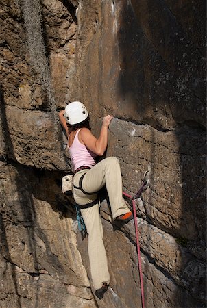 simsearch:625-01040859,k - Rear view of a female rock climber scaling a rock face Stock Photo - Premium Royalty-Free, Code: 625-01744181