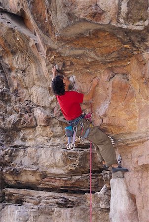 simsearch:625-01040859,k - Rear view of a male rock climber scaling a rock face Stock Photo - Premium Royalty-Free, Code: 625-01744182