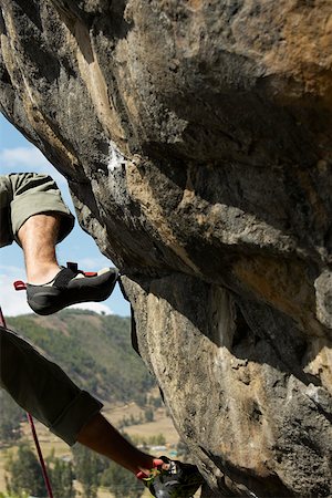 extreme rock climbing close up - Low section view of a rock climber on a rock Stock Photo - Premium Royalty-Free, Code: 625-01744196
