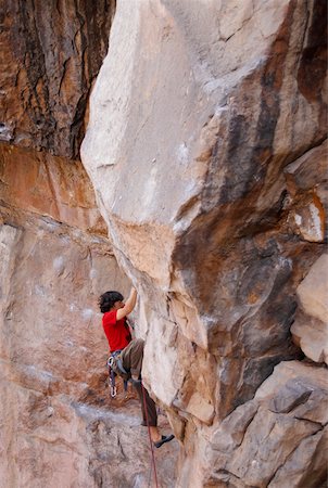 simsearch:625-01040859,k - High angle view of a male rock climber scaling a rock face Stock Photo - Premium Royalty-Free, Code: 625-01744238