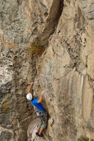 simsearch:625-01040859,k - High angle view of a male rock climber scaling a rock face Stock Photo - Premium Royalty-Free, Code: 625-01744256