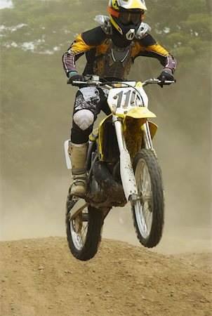 simsearch:625-01744331,k - Motocross rider performing a jump on a motorcycle Foto de stock - Sin royalties Premium, Código: 625-01744259