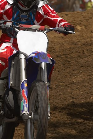 simsearch:625-01744331,k - Close-up of a motocross rider riding a motorcycle Foto de stock - Sin royalties Premium, Código: 625-01744282