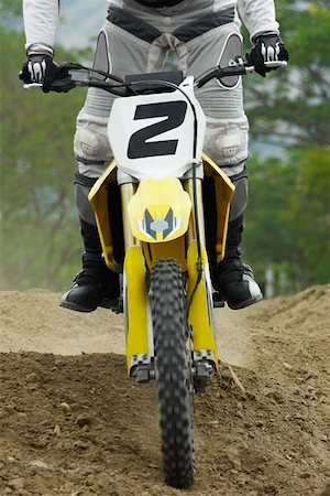 simsearch:625-01744331,k - Low section view of a motocross rider riding a motorcycle Foto de stock - Sin royalties Premium, Código: 625-01744296