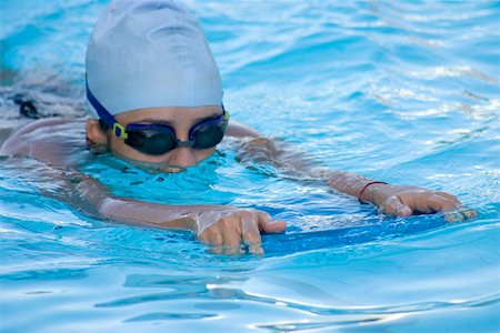 simsearch:625-01038267,k - Close-up of a young woman swimming in a swimming pool Stock Photo - Premium Royalty-Free, Code: 625-01744391