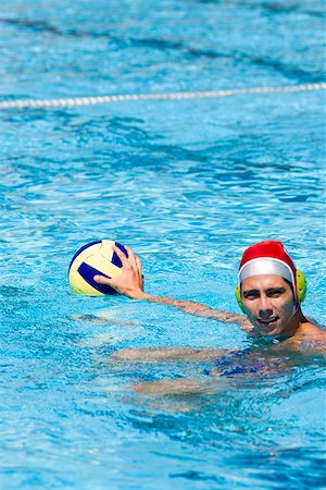 simsearch:625-01038267,k - Mid adult man playing water polo in a swimming pool Stock Photo - Premium Royalty-Free, Code: 625-01744457