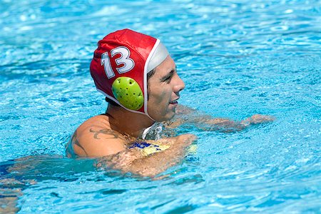 simsearch:625-01038267,k - Mid adult man playing water polo in a swimming pool Stock Photo - Premium Royalty-Free, Code: 625-01744462