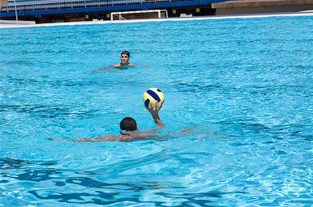 simsearch:625-01038267,k - Two young men playing water polo in a swimming pool Stock Photo - Premium Royalty-Free, Code: 625-01744470