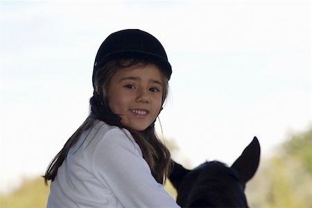 simsearch:625-00806471,k - Portrait of a girl riding a horse and smiling Foto de stock - Sin royalties Premium, Código: 625-01744521