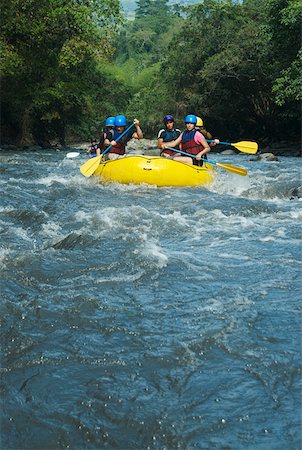 rubber raft - Five people rafting in a river Stock Photo - Premium Royalty-Free, Code: 625-01744561