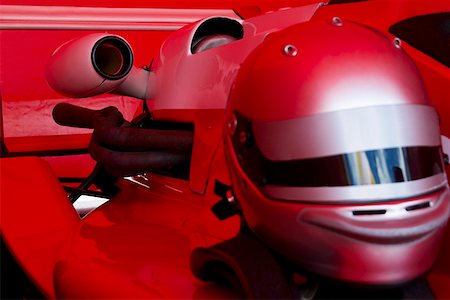 sport car speed - Close-up of a crash helmet on a racecar Stock Photo - Premium Royalty-Free, Code: 625-01744613