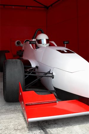 simsearch:625-01744655,k - Racecar driver in a racecar under a shed Stock Photo - Premium Royalty-Free, Code: 625-01744654