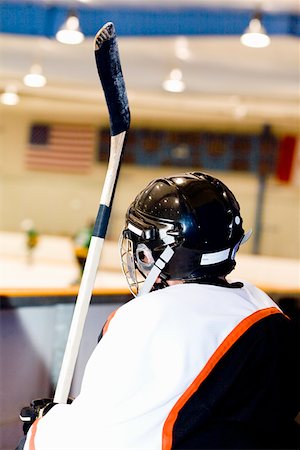 simsearch:625-01038051,k - Rear view of an ice hockey player near an ice rink Stock Photo - Premium Royalty-Free, Code: 625-01744813