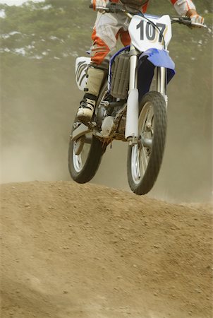 simsearch:625-01744331,k - Motocross rider riding a motorcycle Foto de stock - Sin royalties Premium, Código: 625-01744842