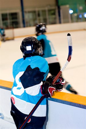 simsearch:625-01038051,k - Rear view of an ice hockey player watching ice hockey Stock Photo - Premium Royalty-Free, Code: 625-01744865