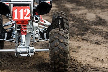 Close-up of a quadbike on sand Stock Photo - Premium Royalty-Free, Code: 625-01744866