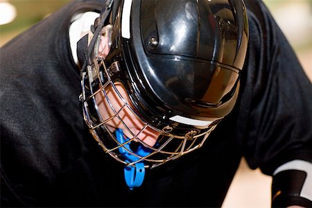 Close-up of a teenage boy in a goalie mask Stock Photo - Premium Royalty-Free, Code: 625-01744908