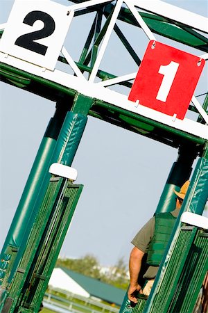 simsearch:832-03358664,k - Two jockeys at the starting gates on a horseracing track Foto de stock - Royalty Free Premium, Número: 625-01744948