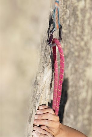 Close-up of a climber's hands gripping a rock Stock Photo - Premium Royalty-Free, Code: 625-01745138