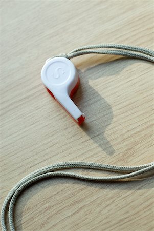 fischietto - Close-up of a whistle with a cord Foto de stock - Sin royalties Premium, Código: 625-01745139