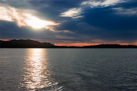 Sunset over the sea, Lembeh Strait, Sulawesi, Indonesia Foto de stock - Sin royalties Premium, Código: 625-01745608