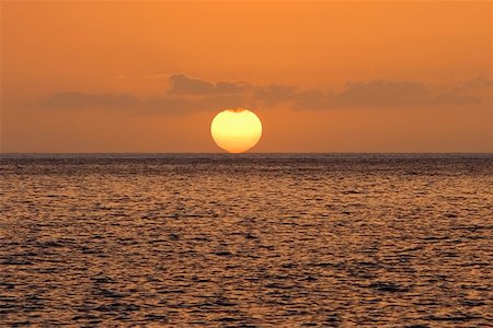 simsearch:625-01098372,k - Sun over the sea, Pakini Nui Wind Project, South Point, Big Island, Hawaii Islands, USA Stock Photo - Premium Royalty-Free, Code: 625-01745752