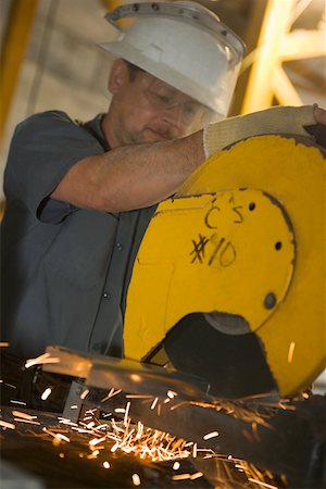 simsearch:625-01097225,k - Close-up of a male construction worker working at a construction site Stock Photo - Premium Royalty-Free, Code: 625-01745791