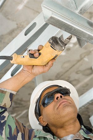 simsearch:625-01745814,k - Close-up of a male construction worker working with a hand drill Stock Photo - Premium Royalty-Free, Code: 625-01745817