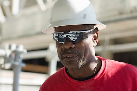 simsearch:625-01097225,k - Close-up of a male construction worker with a hardhat and a pair of sunglasses Stock Photo - Premium Royalty-Free, Code: 625-01745836