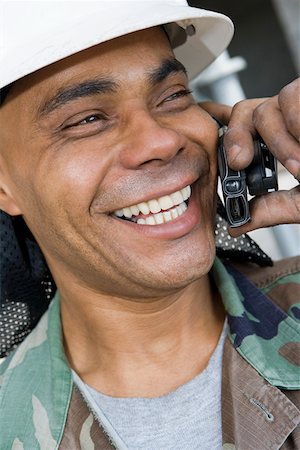 simsearch:625-01097225,k - Close-up of a mature man talking on a mobile phone and smiling Stock Photo - Premium Royalty-Free, Code: 625-01745845